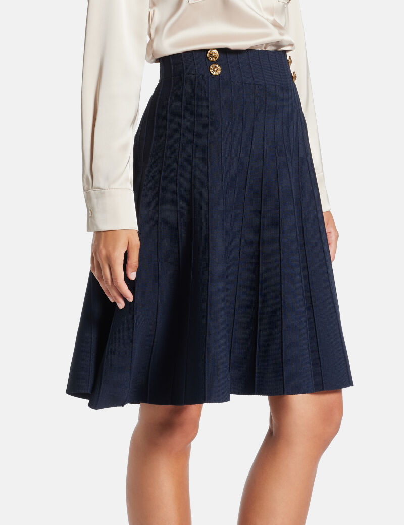 Pleated mini sweater skirt