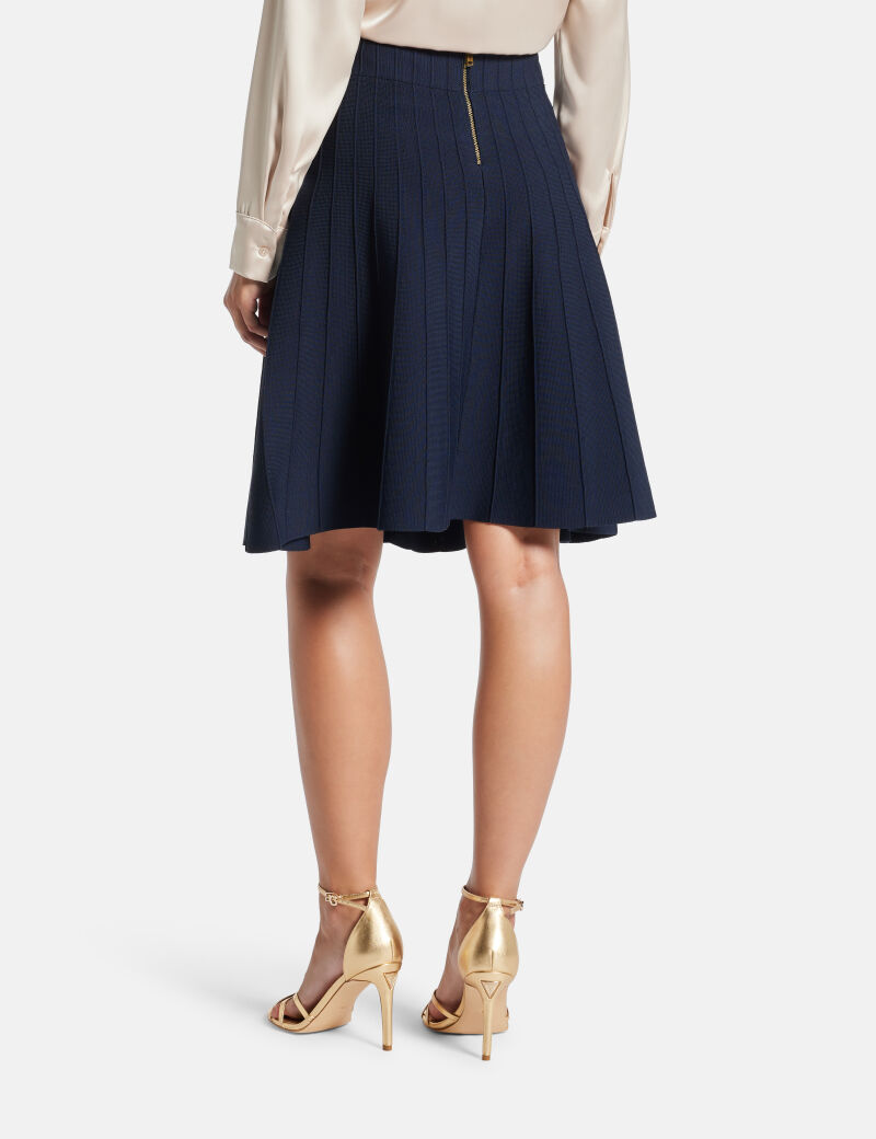 Pleated mini sweater skirt